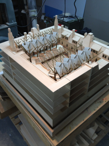 Miniatura artisan assembling a scale model